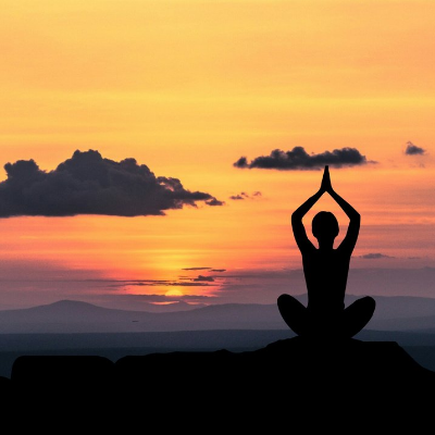 woman silhouette doing yoga before sunset Pulmonary Associates of Richmond